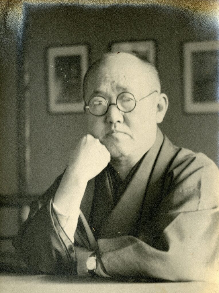 Kawase Hasui resting on his elbow.